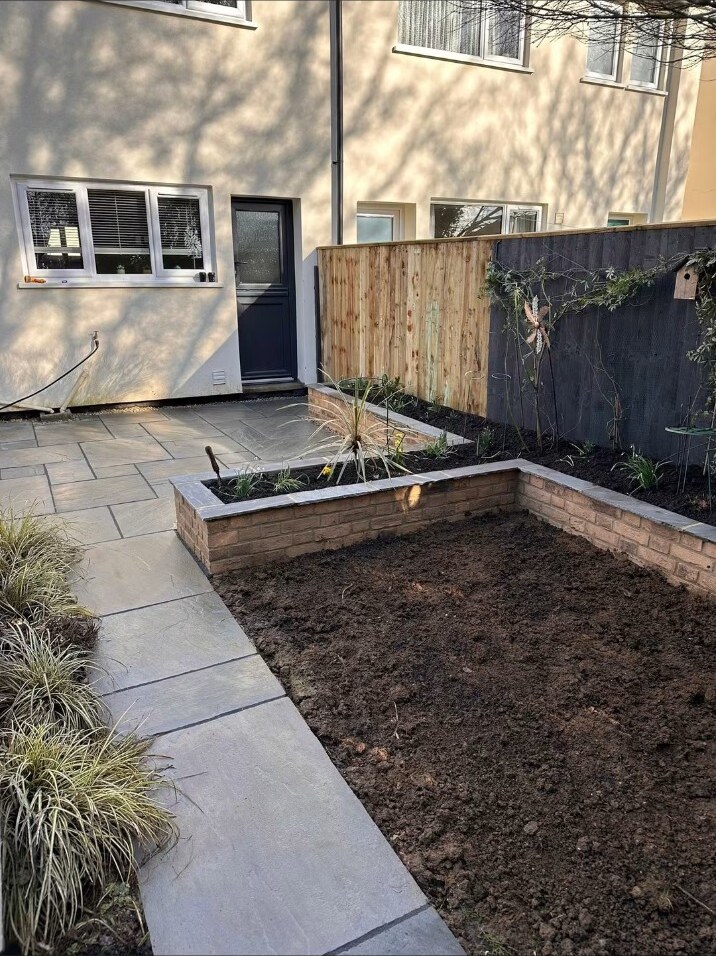 Completed planting beds and sandstone path